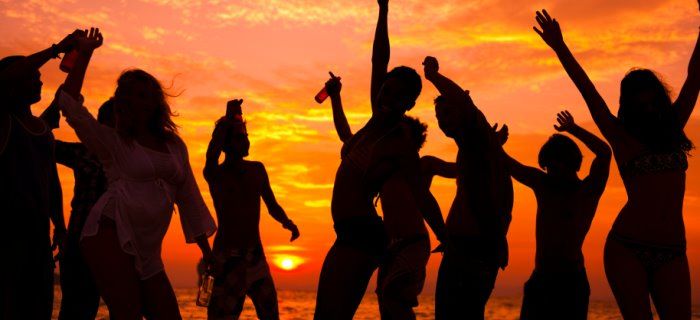 beach dancing young people sunset aruba.