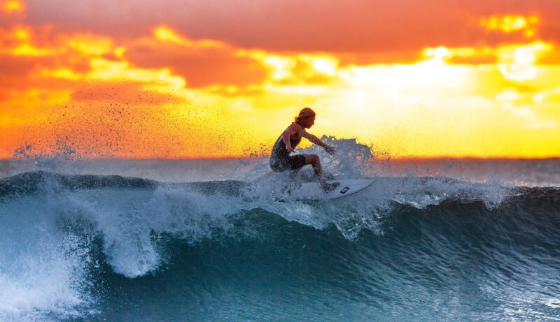 surfer-blue-wave-sunset