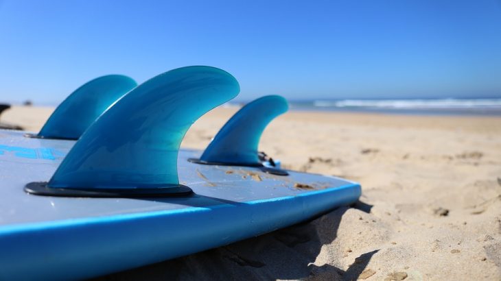 surf-board-in-golden-sand