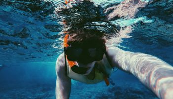 boy-snorkeling-blue-water