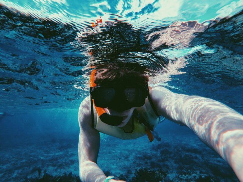 boy-snorkeling-blue-water