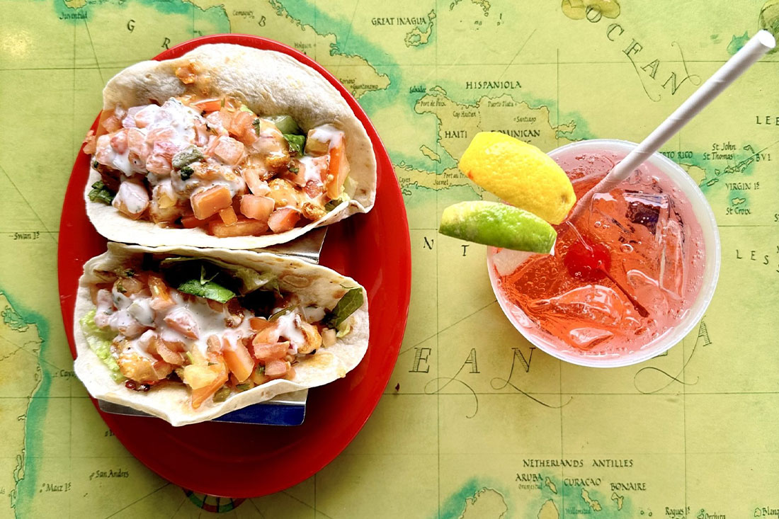 aerial of tacos and cocktail at Iggies Beach Bar & Grill