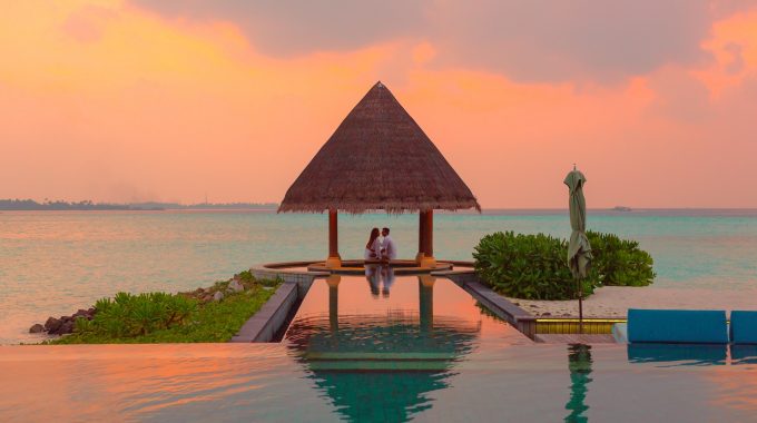 couple-sunset-beach-hut-ocean