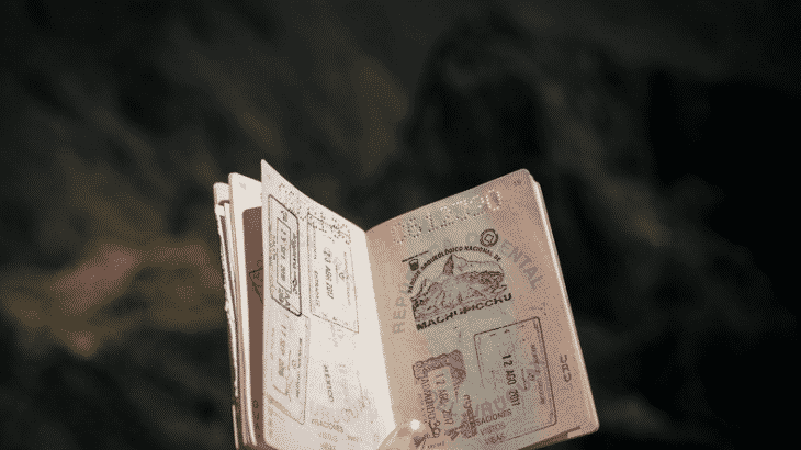 hand-holding-open-passport