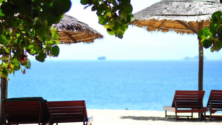 beach-tikis-chairs-blue-water