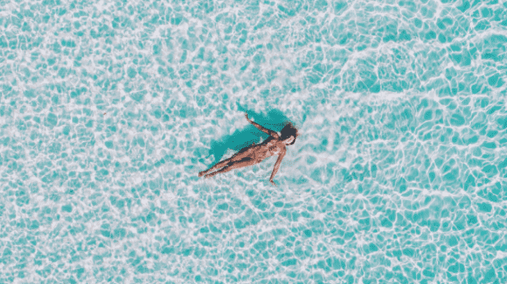 woman-floating-crystal-clear-water