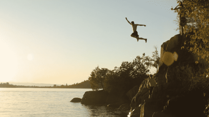 man-jumping-off-cliff