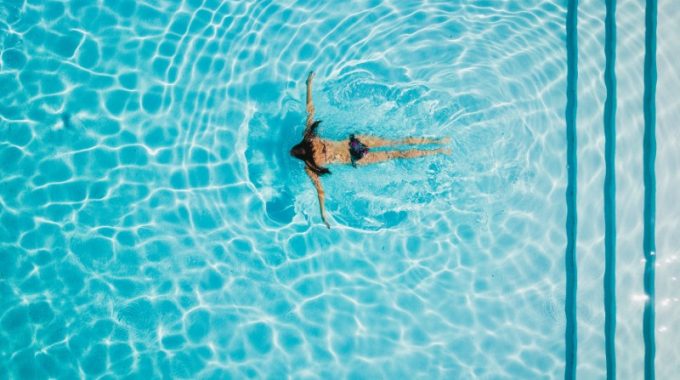 girl-swimming-pool-water-blue