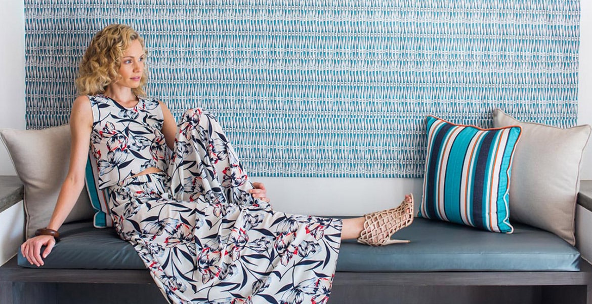 woman-wearing-long-dress-sitting-on-couch