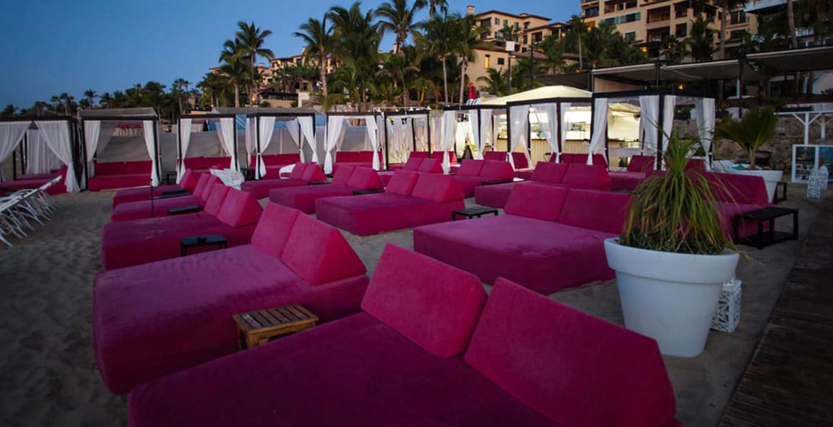 hot-pink-loungers-on-beach-sunset