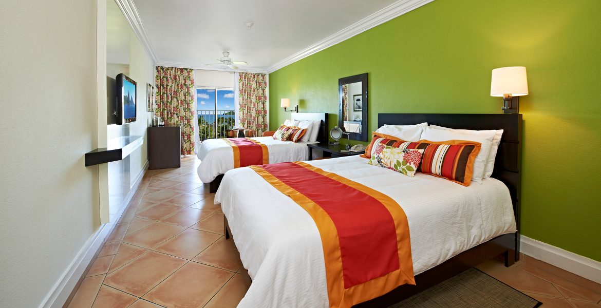 resort-suite-green-walls-white-bed