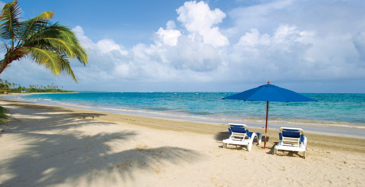 white-sand-beach-blue-ocean-island-in-distance