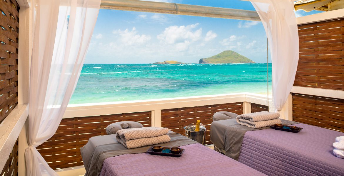 open-spa-room-massage-tables-overlooking-ocean-and-island