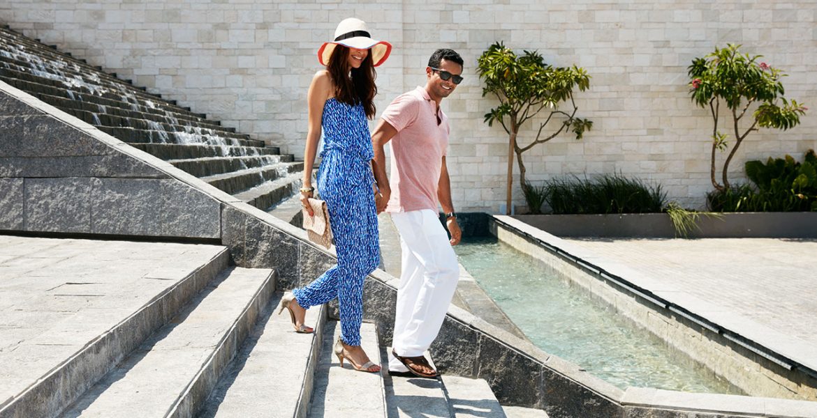 fancy-couple-walking-down-resort-steps