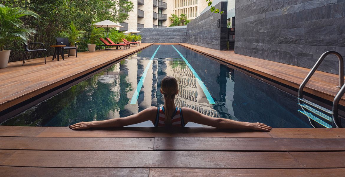 woman-sitting-in-resort-pool