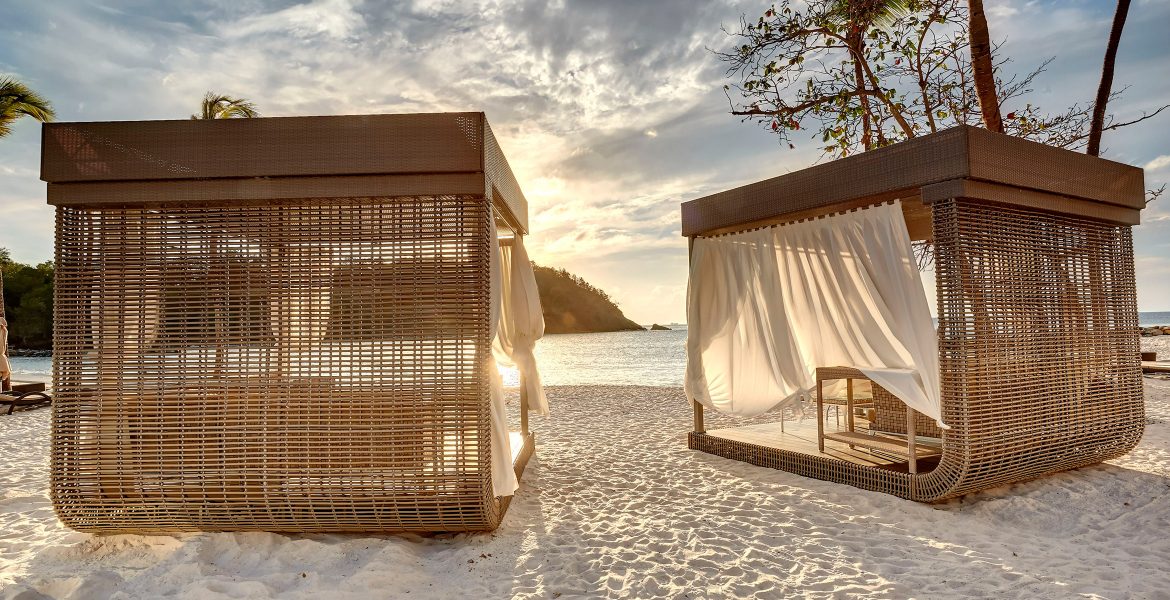 beach-cabanas-white-sand-sunset