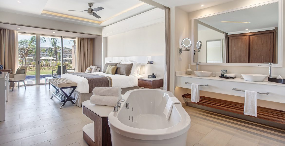 resort-suite-spa-tub-in-room-white-bed