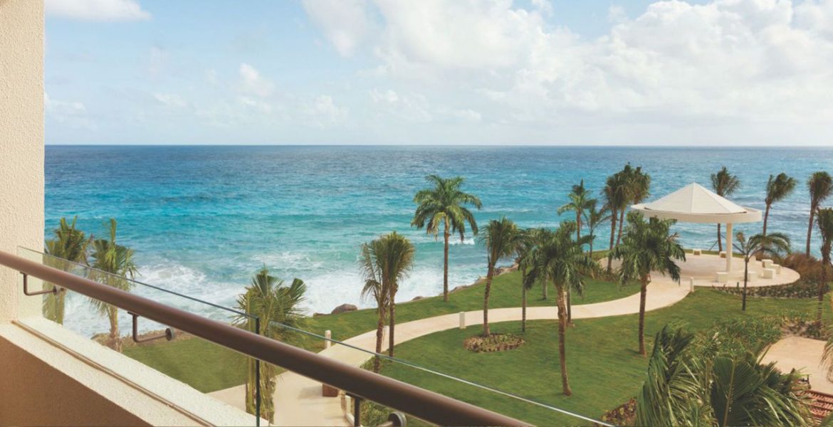 balcony-view-walkway-palm-trees-turquoise-ocean