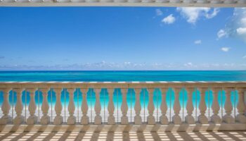 luxury-suite-balcony-turquoise-ocean-view-blue-sky