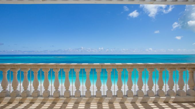 luxury-suite-balcony-turquoise-ocean-view-blue-sky