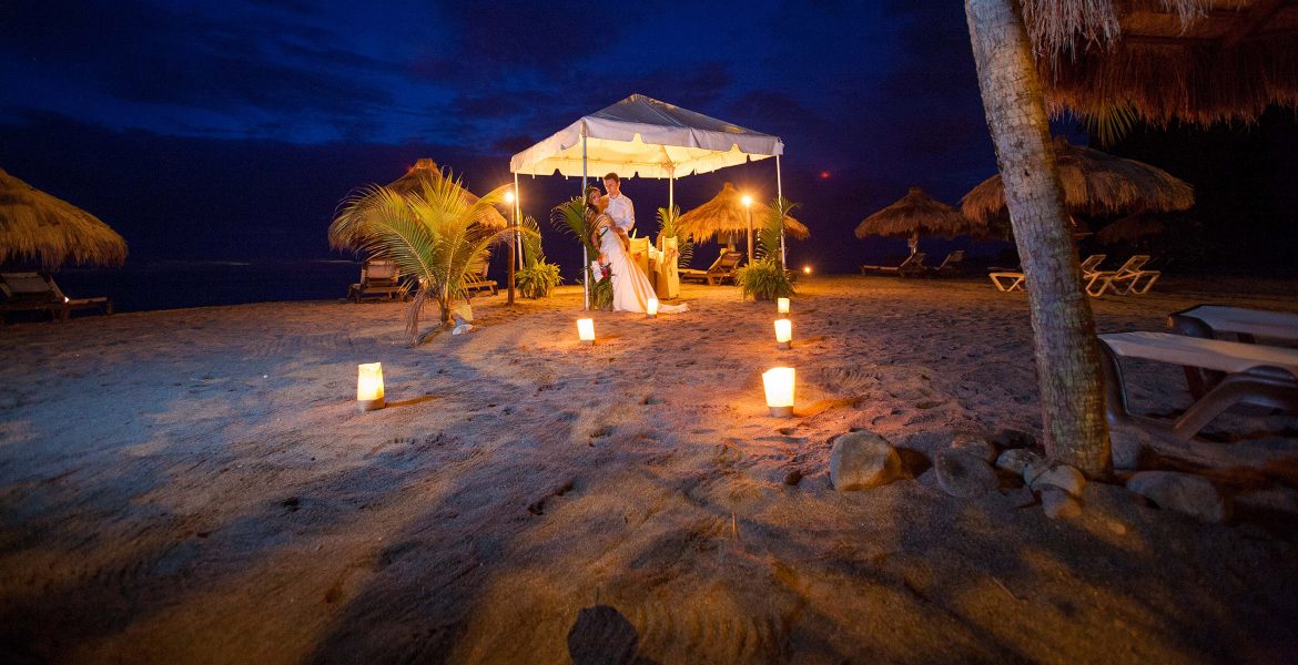 tent-on-beach-at-night-with-bride-and-groom