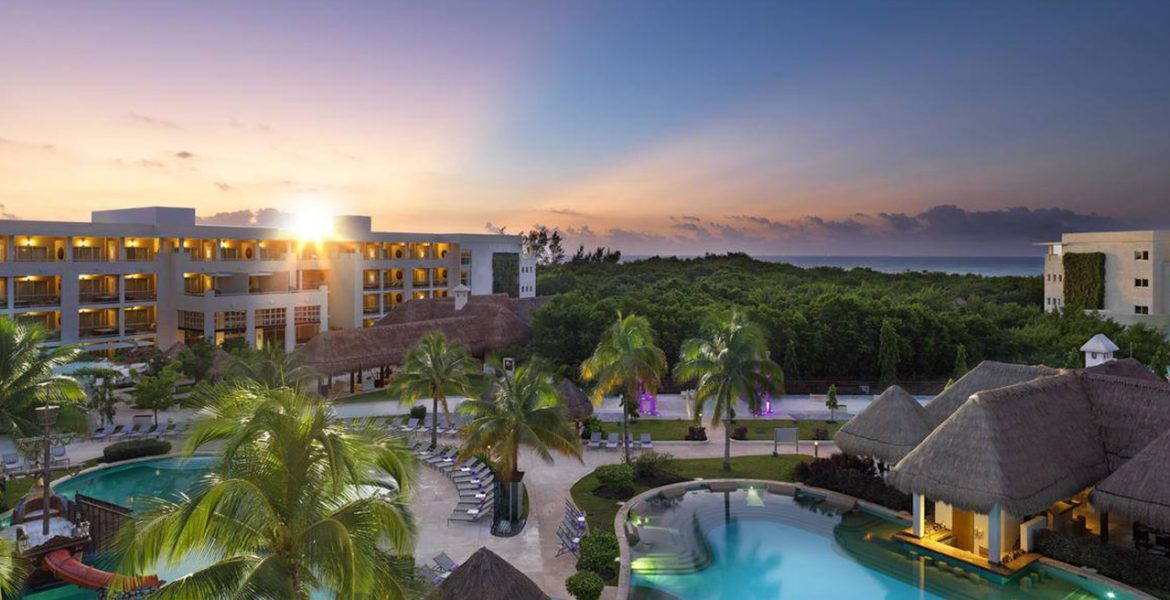 aerial-view-beach-resort-sunset-buildings-palm-trees