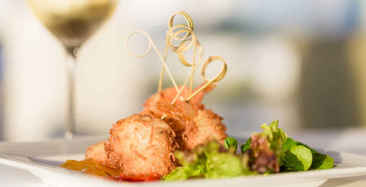 coconut-crusted-seafood-on-plate-with-green