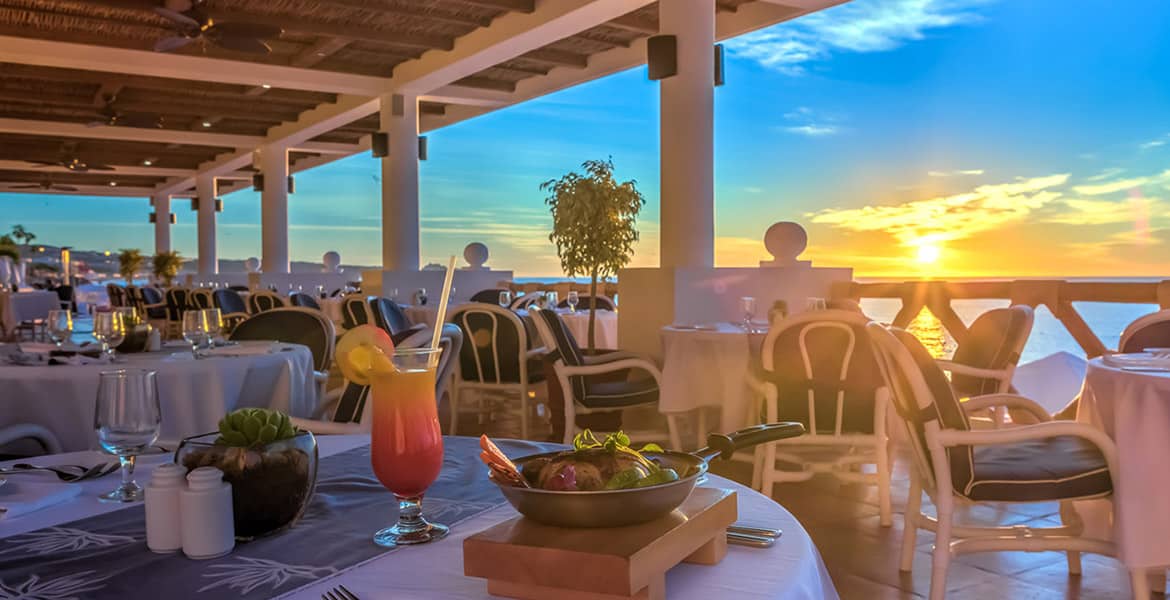 open-air-dining-at-resort-sunset-overlooking-ocean