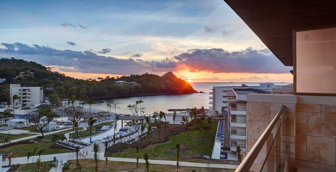 resort-buildings-overlooking-bay-sunset