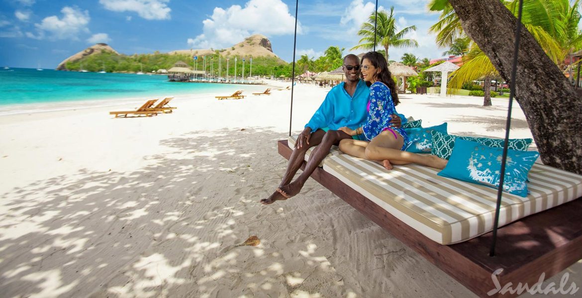 couple-on-hanging-bed-on-beach-sandals-grand-st-lucian