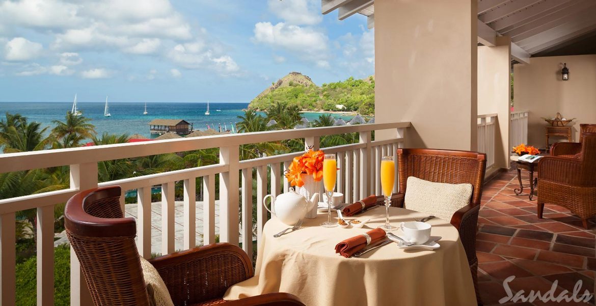 dining-balcony-overlooking-cove-sandals-grand-st-lucian