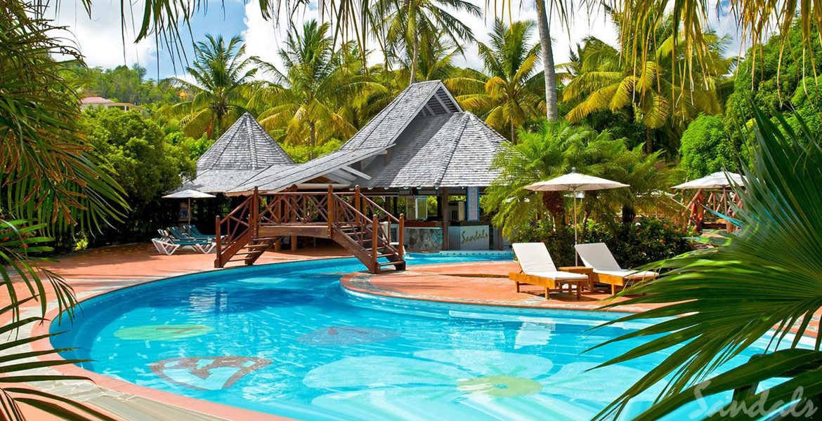 clear-pool-beach-chairs-huts-green-palm-trees