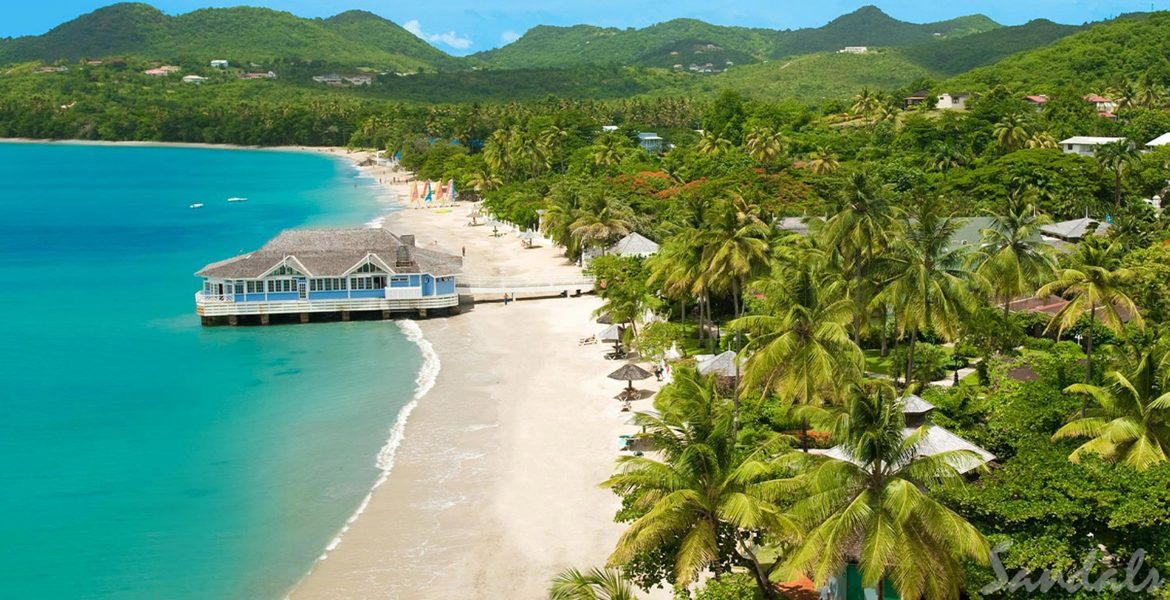 aerial-view-beach-turquoise-water-white-sand-green-jungle