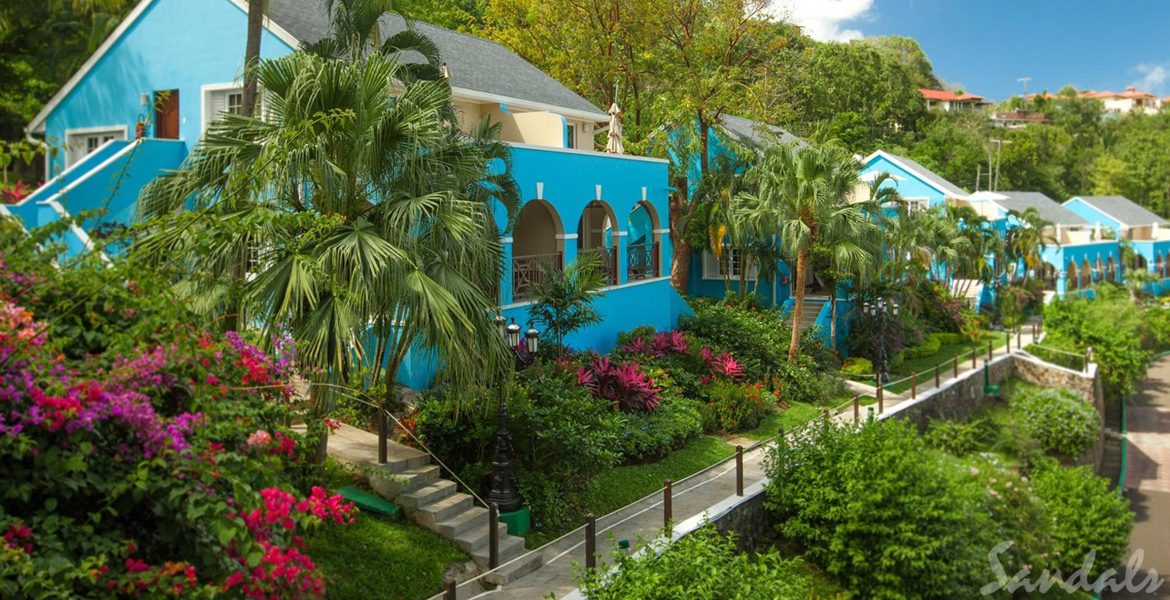 blue-resort-villa-surrounded-by-flowers