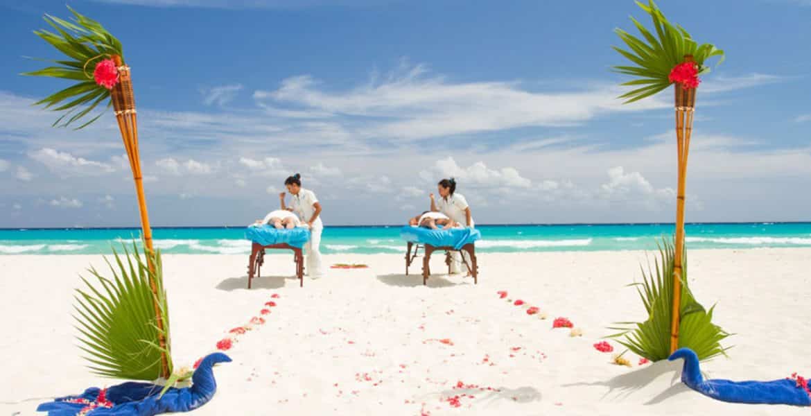 couple-getting-massages-on-beach