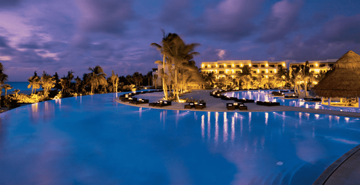 resort-pool-at-night-blue-water