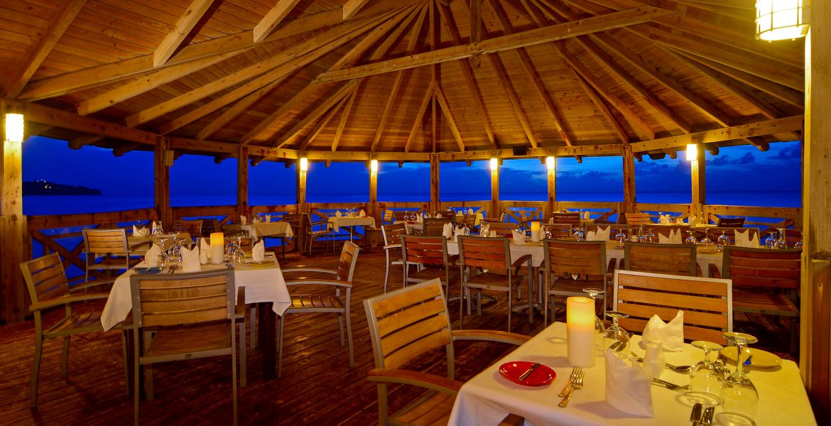 outside-dining-over-water-st-james-club-morgan-bay