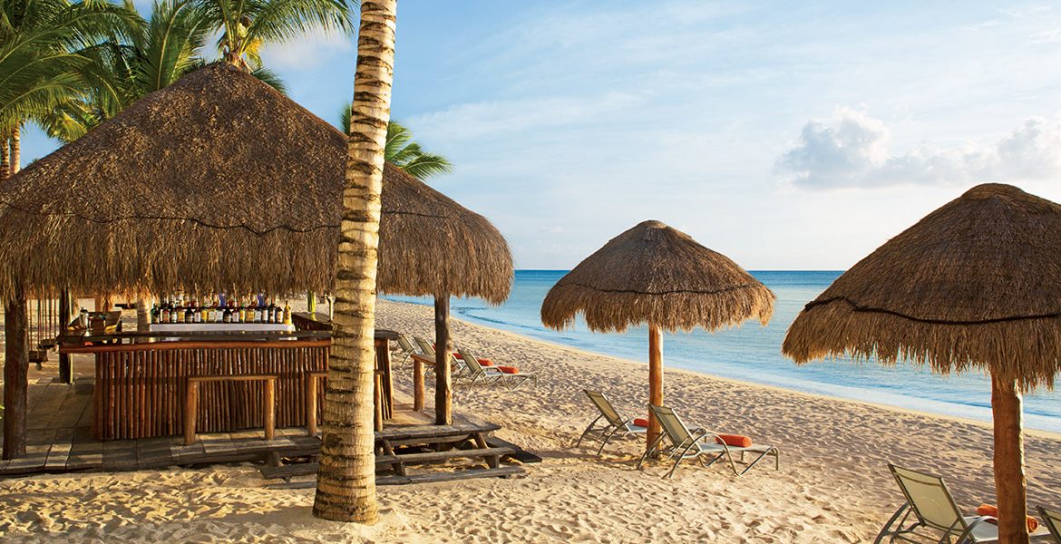 golden-sand-beach-with-tiki-umbrellas