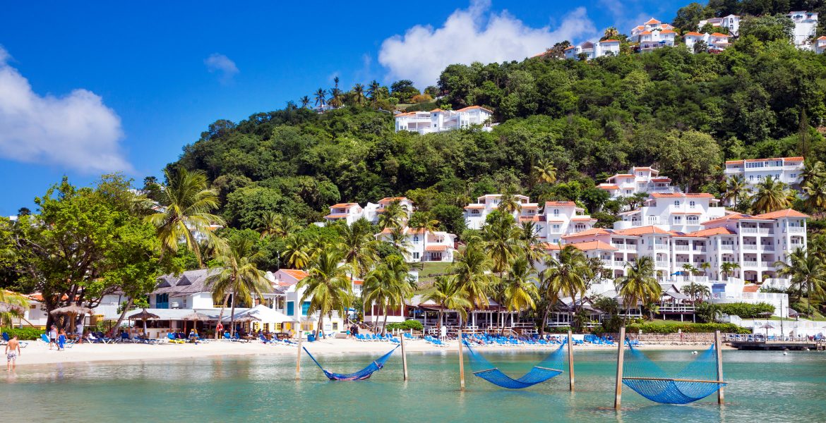 overwater-hammocks-blue-cove-green-mountain-behind-windjammer-landing-resort-st-lucia