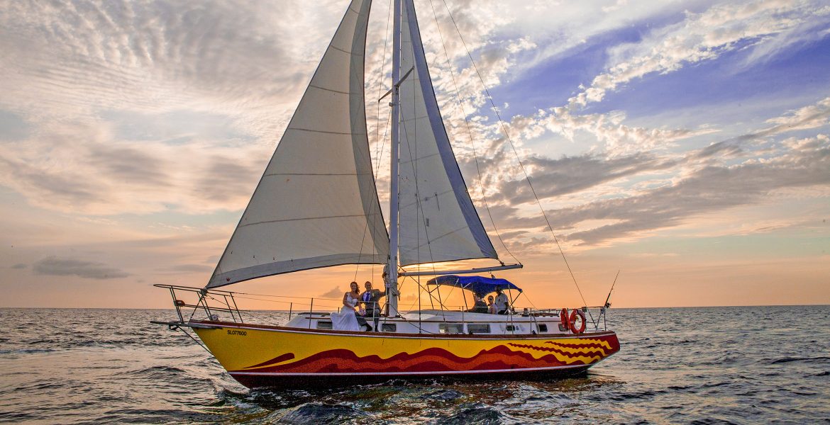 sailboat-sunset-blue-water