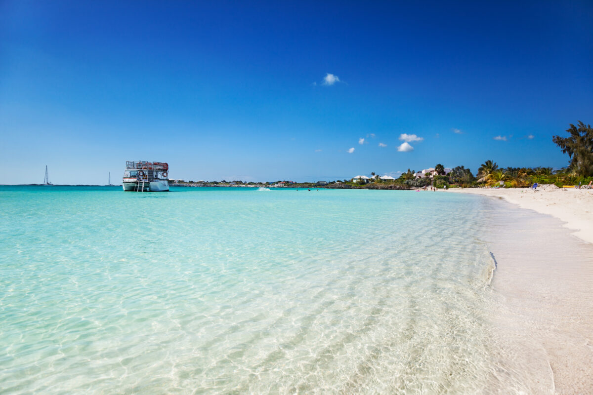 The calm shallow waters and white sands of Sapodilla Bay, Turks & Caicos.