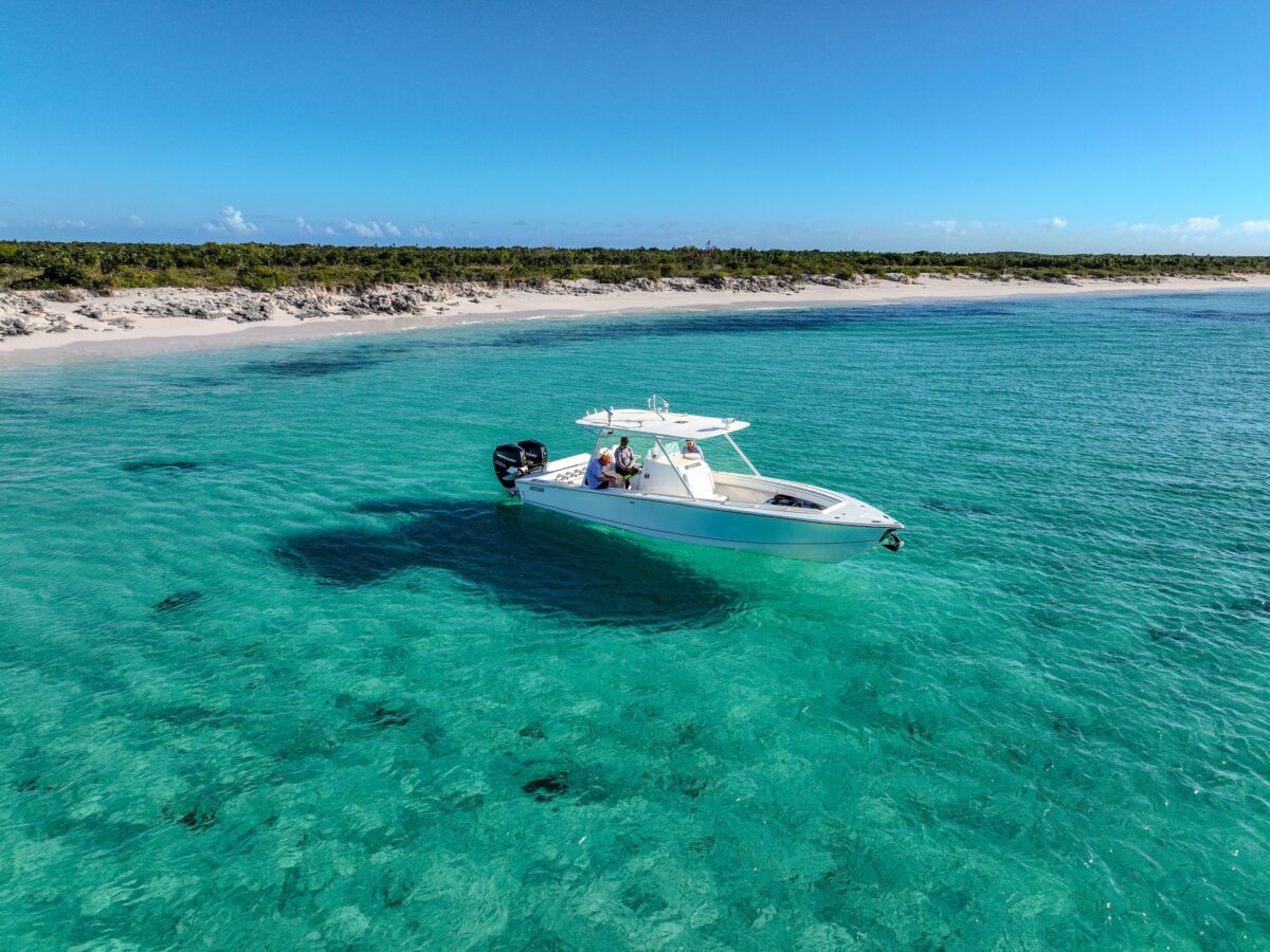 Lone boat anchored off the powdery white beach of Pine Cay in the Turks and Caicos.