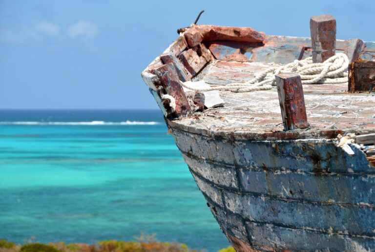 shipwreck-on-land-turquoise-water-background