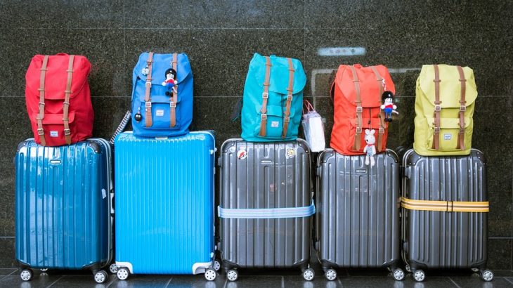 suitcases-colorful-backpacks-on-top