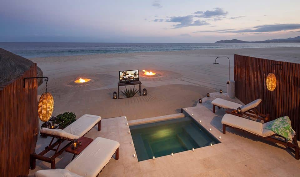 Outdoor Beach Cinema on the sand with the ocean in the background