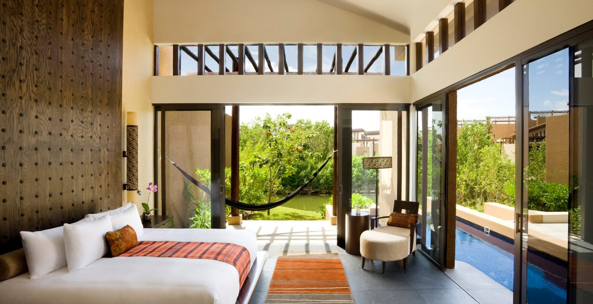 resort-suite-white-bed-orange-accent