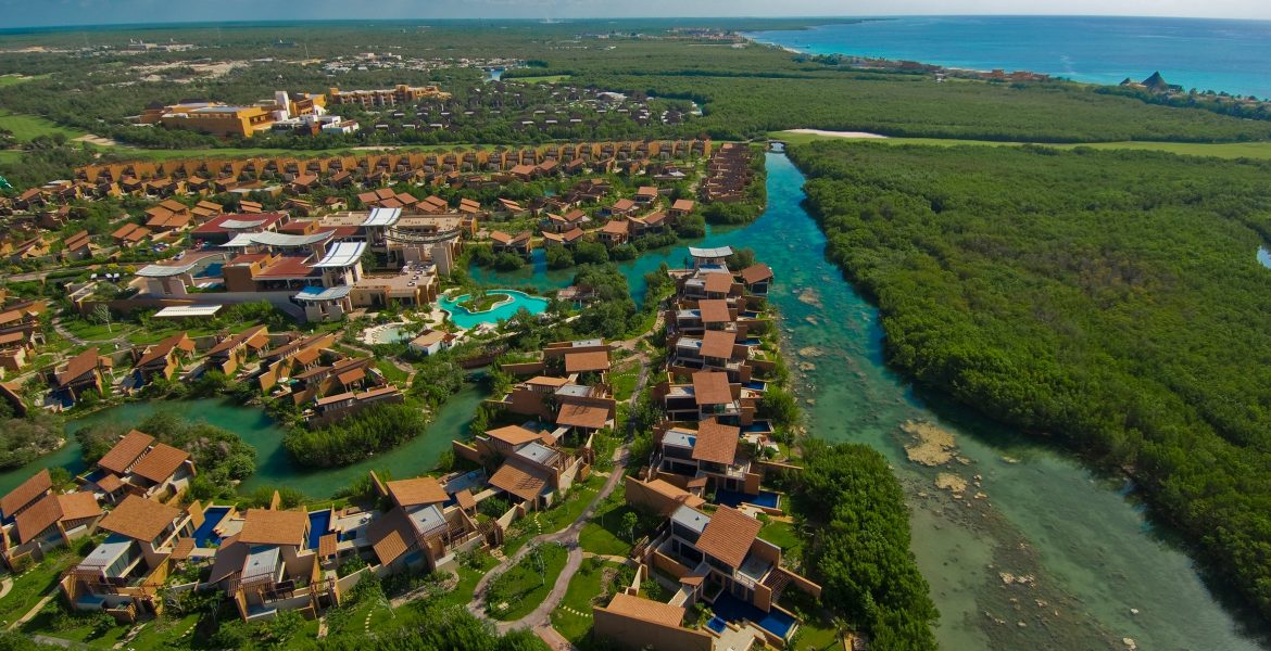 aerial-view-resort-buildings-on-turquoise-river