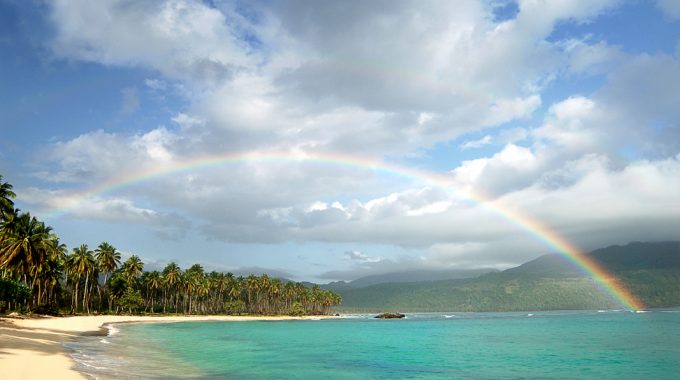picturesque-beach-rainbow-over-turquoise-water