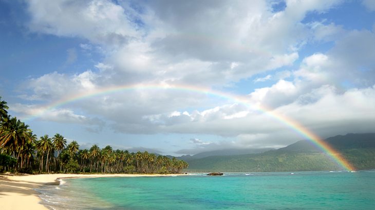 picturesque-beach-rainbow-over-turquoise-water