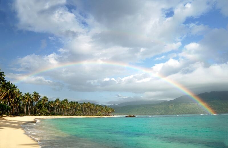 picturesque-beach-rainbow-over-turquoise-water